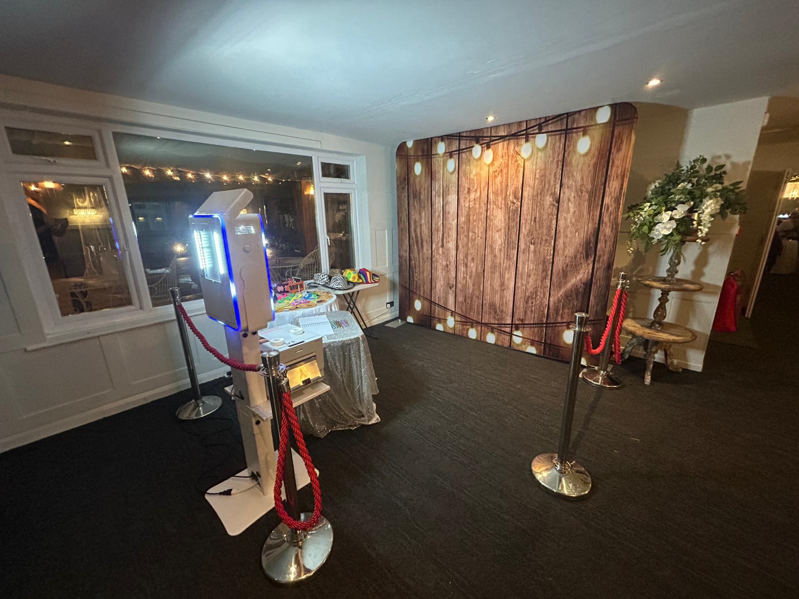 Peachey Events print photo booth with rustic backdrop and props