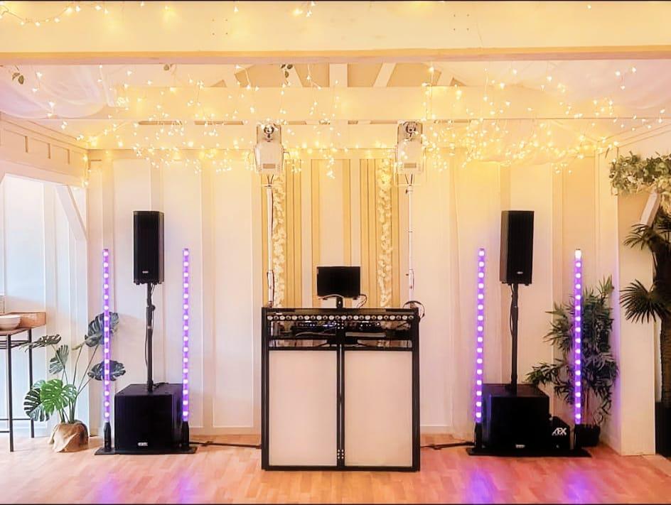 Peachey Events wedding DJ setup with fairy lights and LED towers